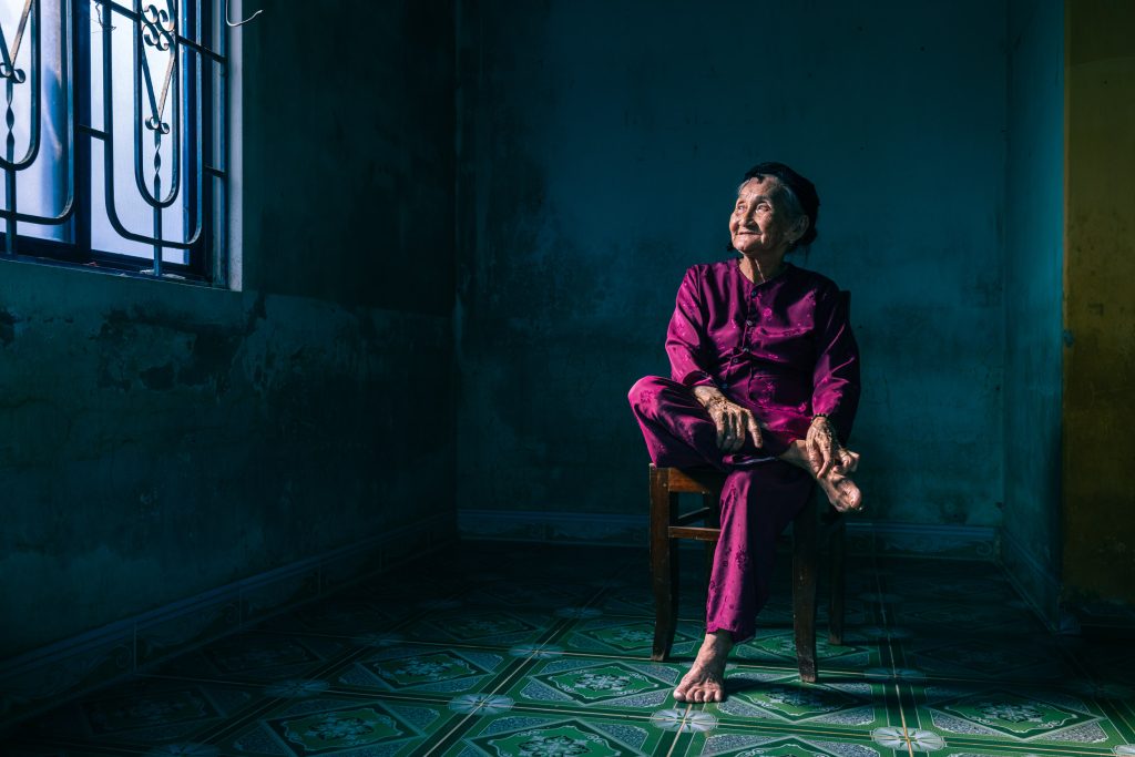 Portrait of Mrs Song. A resident of Hoi An in central Vietnam. She is famous for a picture entitled hidden smile.