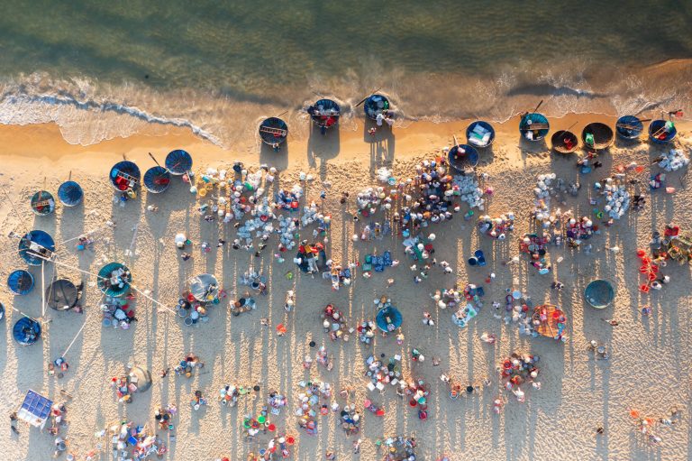 Aerial drone point of view of a market on a beach near to Hoi An, Quang Nam, Vietnam.