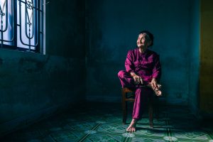 Portrait of Mrs Song. A resident of Hoi An in central Vietnam. She is famous for a picture entitled hidden smile.